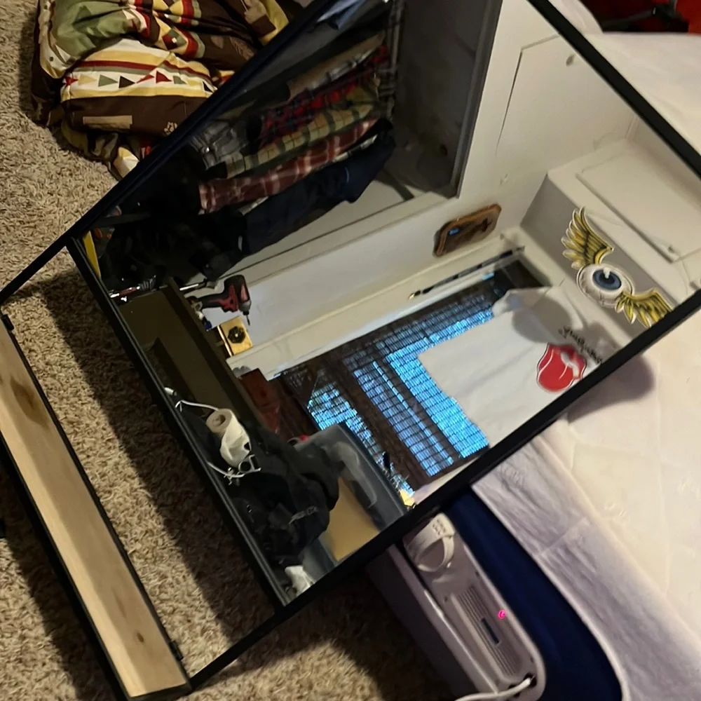 Mirror with cosmetic shelf